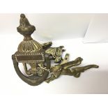 Old cherub door knocker and two others, all brass