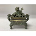 A small Chinese bronze censor with the pierced lid
