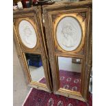 A pair of large gilt wall mirrors with classical t
