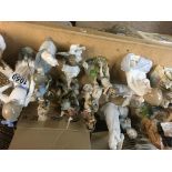 A collection of Lladro figures and other cherubs f
