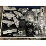 4 metal cases and a large collection of assorted camera equipment and lenses and mixed ephemera.