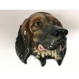 A Beswick wall mask of a dog, approx height 28cm.