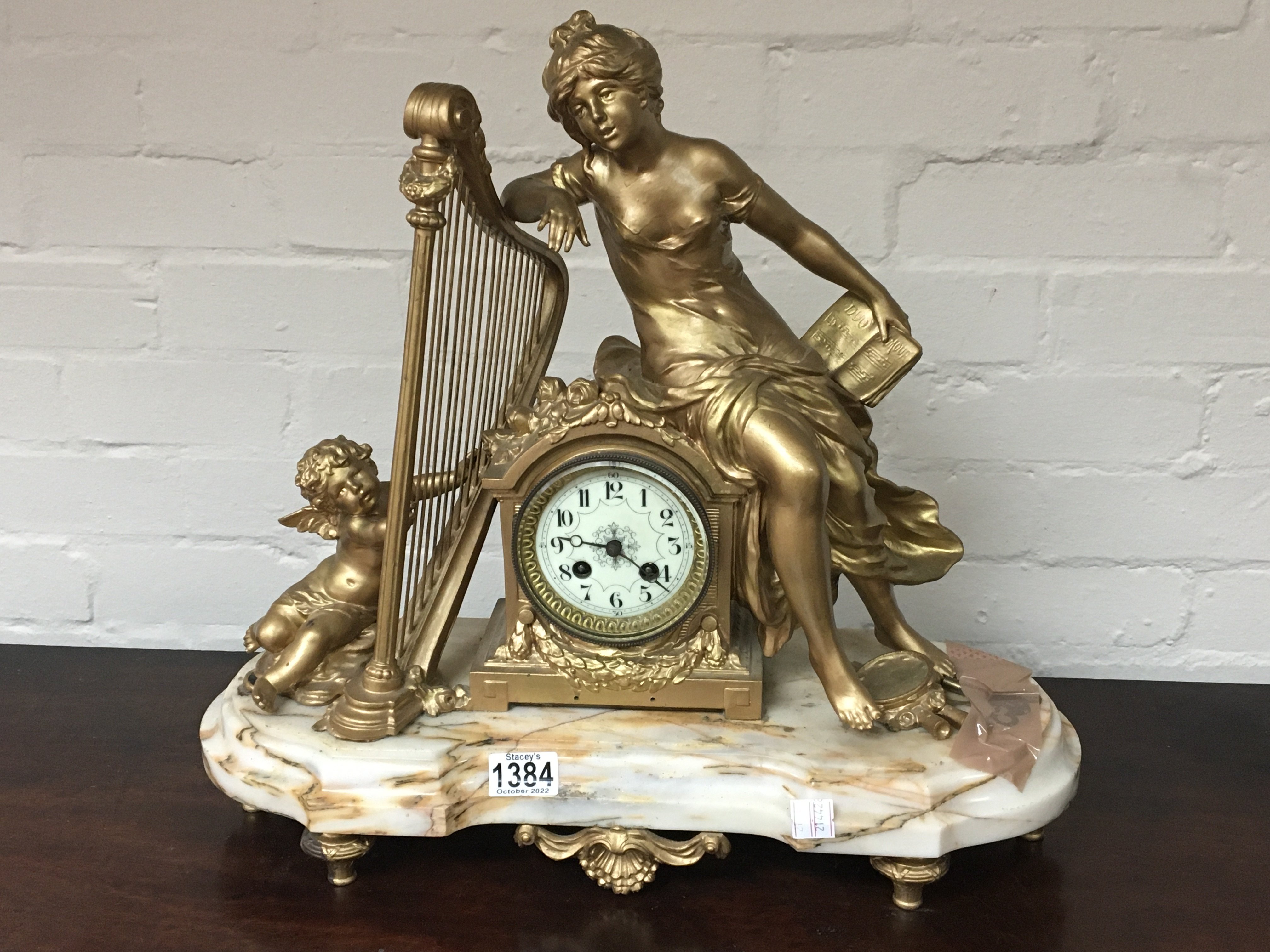 A French late 19th century mantel clock with gilde