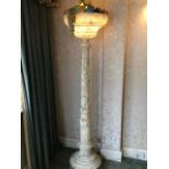 A large carved Marble early 20thC lamp with a coll