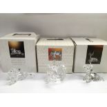 Three boxed Swarovski African animal ornaments.