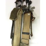 Two Vintage golf bags containing golf clubs includ