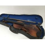 A 3/4 size violin in a fitted case with bow for re