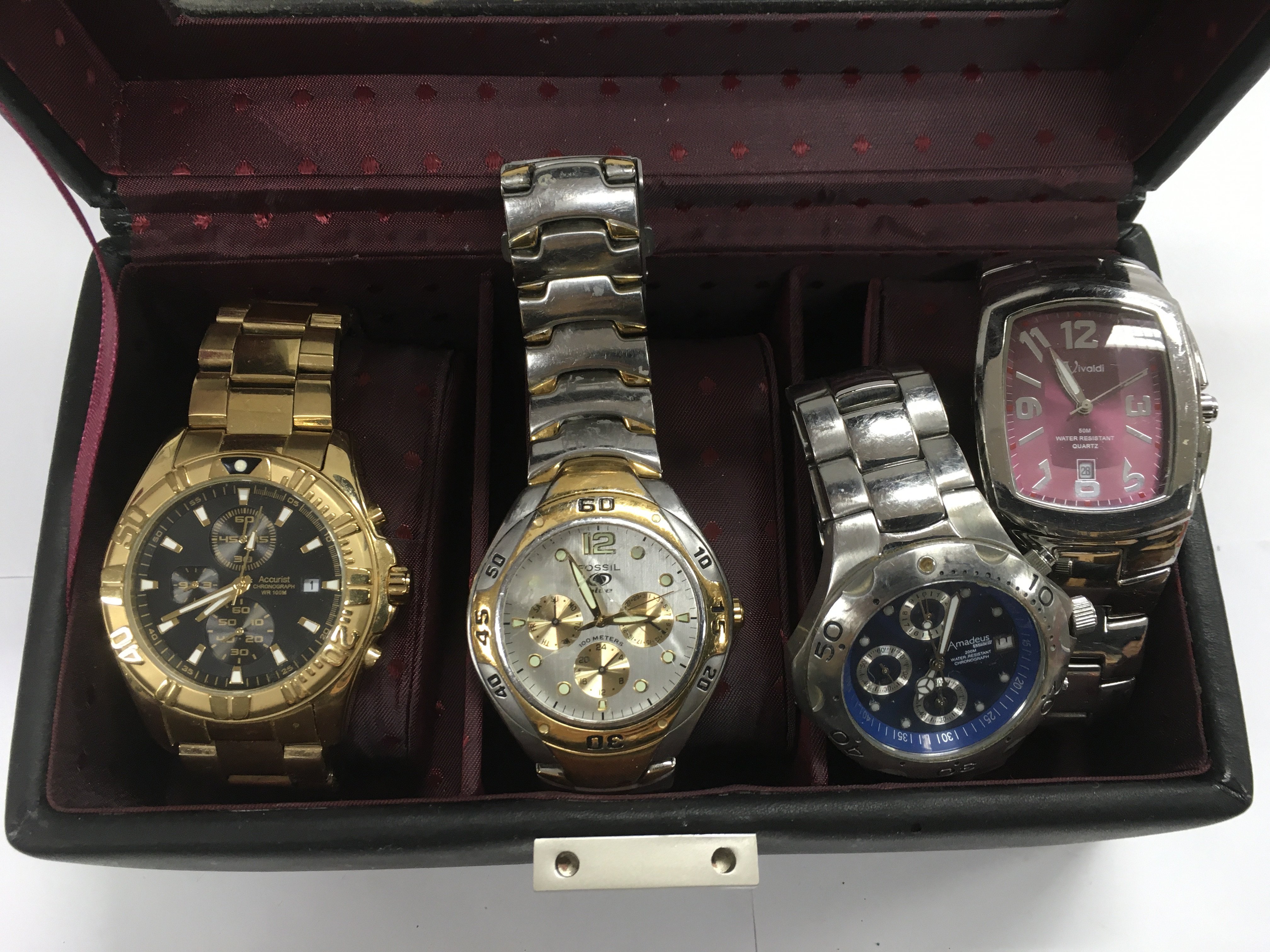 Four gents watches comprising Accurist, Fossil and others,