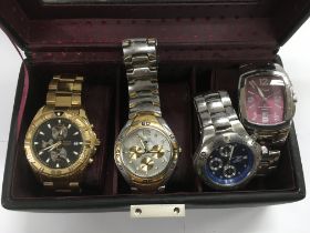 Four gents watches comprising Accurist, Fossil and others,
