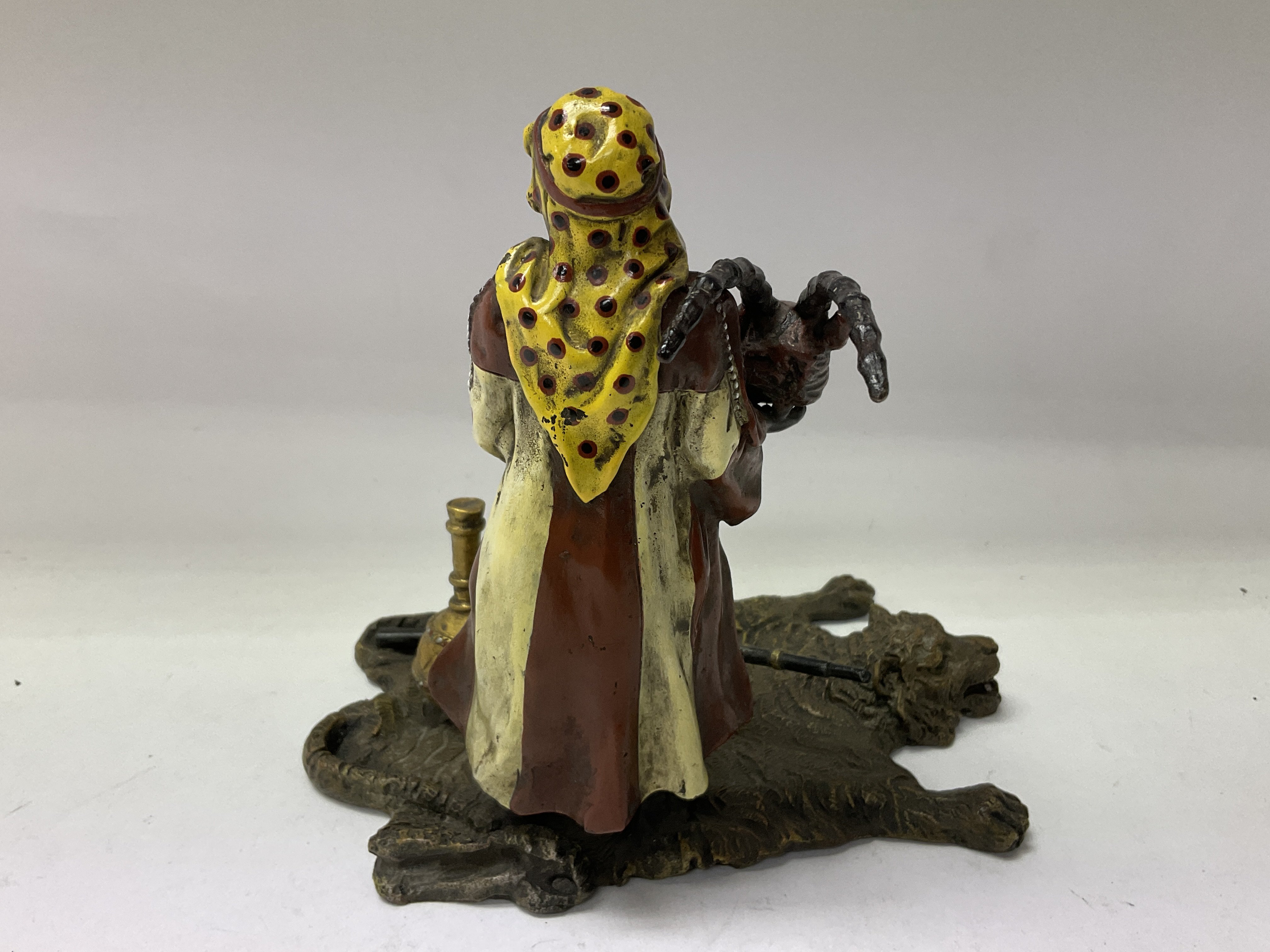 A cold painted bronze Arab figure holding a rams h - Image 5 of 7