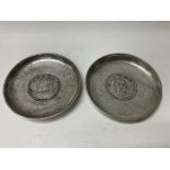 A pair of Chinese white metal coin dishes. 9.5cm d