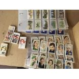 A collection of cigarette cards including players