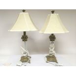 A pair of Corinthian column glass and gilt metal modern table lamps.