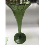 A Victorian green glass trumpet vase 40 cm .