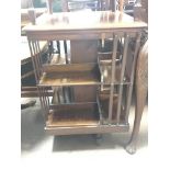 An Edwardian Mahogany revolving bookcase for restoration.