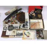A collection of WW1 and WW2 items including medals, photographs, POW drawings, map etc.