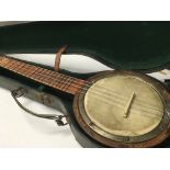 A cased banjolay.