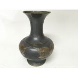 Unusual heavy metal Chinese vase decorated with tw