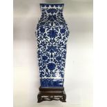 An Oriental blue and white squared vase with faux