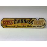 A reproduction cast iron Guinness extra stout sign