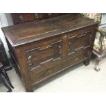 An 18th century style oak marriage chest with a hi