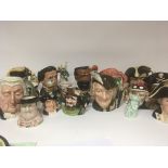 A collection of large Doulton character jugs and o