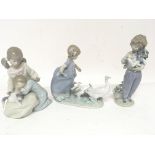 Three Lladro figure groups of children with animal