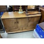 A blonde Ercol sideboard. 130 x 48 x 76cm