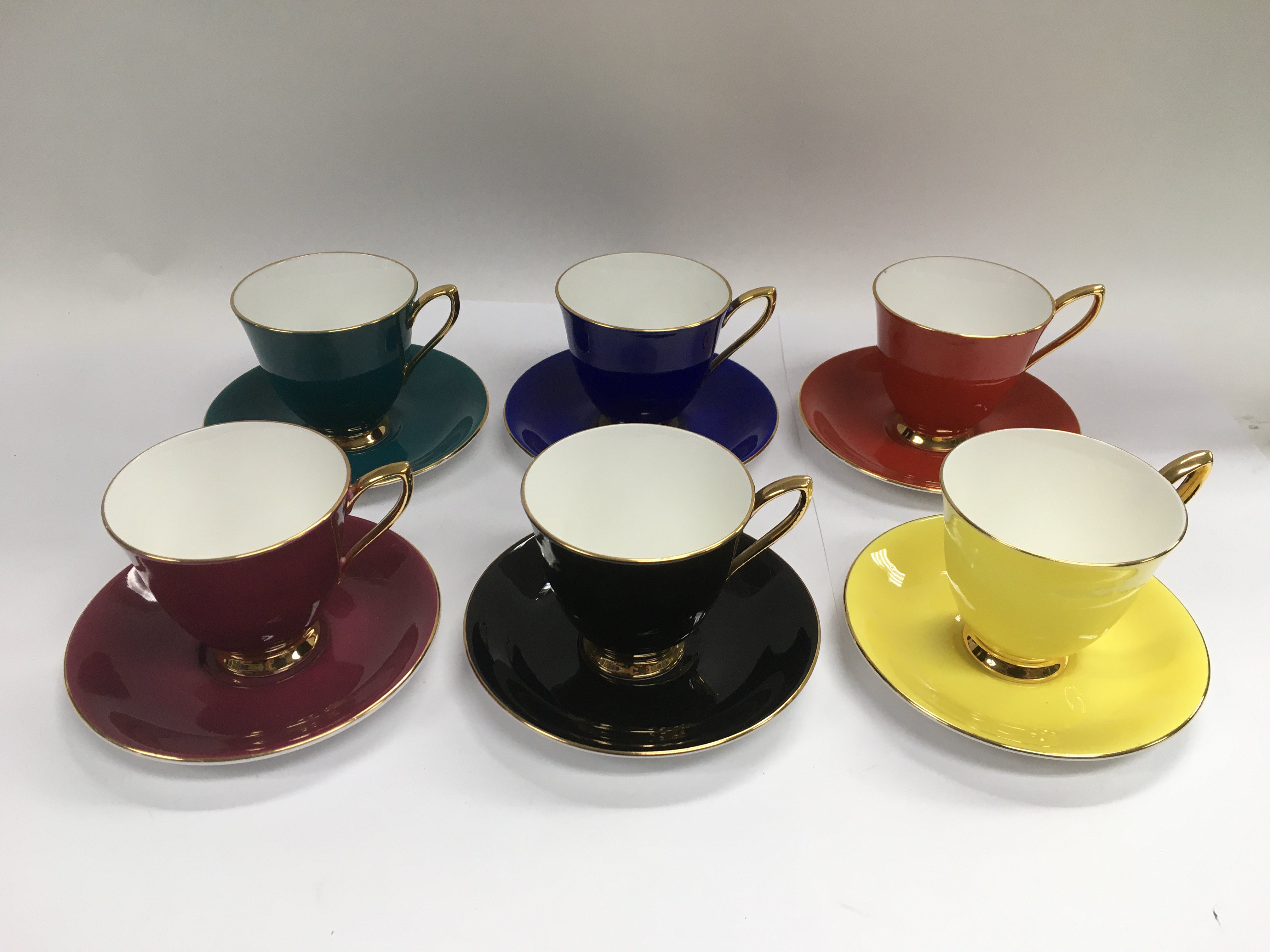 A Royal Albert Harlequin coffee set comprising six