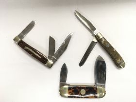 Three collectable pocket knives including one by S