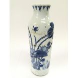 A small blue and white bottle vase decorated with