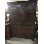 A Victorian mahogany linen press with a moulded co
