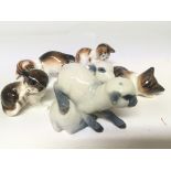 A collection of Porcelain Royal Doulton cat orname