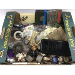 A box of various items including a vintage teethin