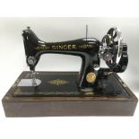 A vintage cased Singer sewing machine.