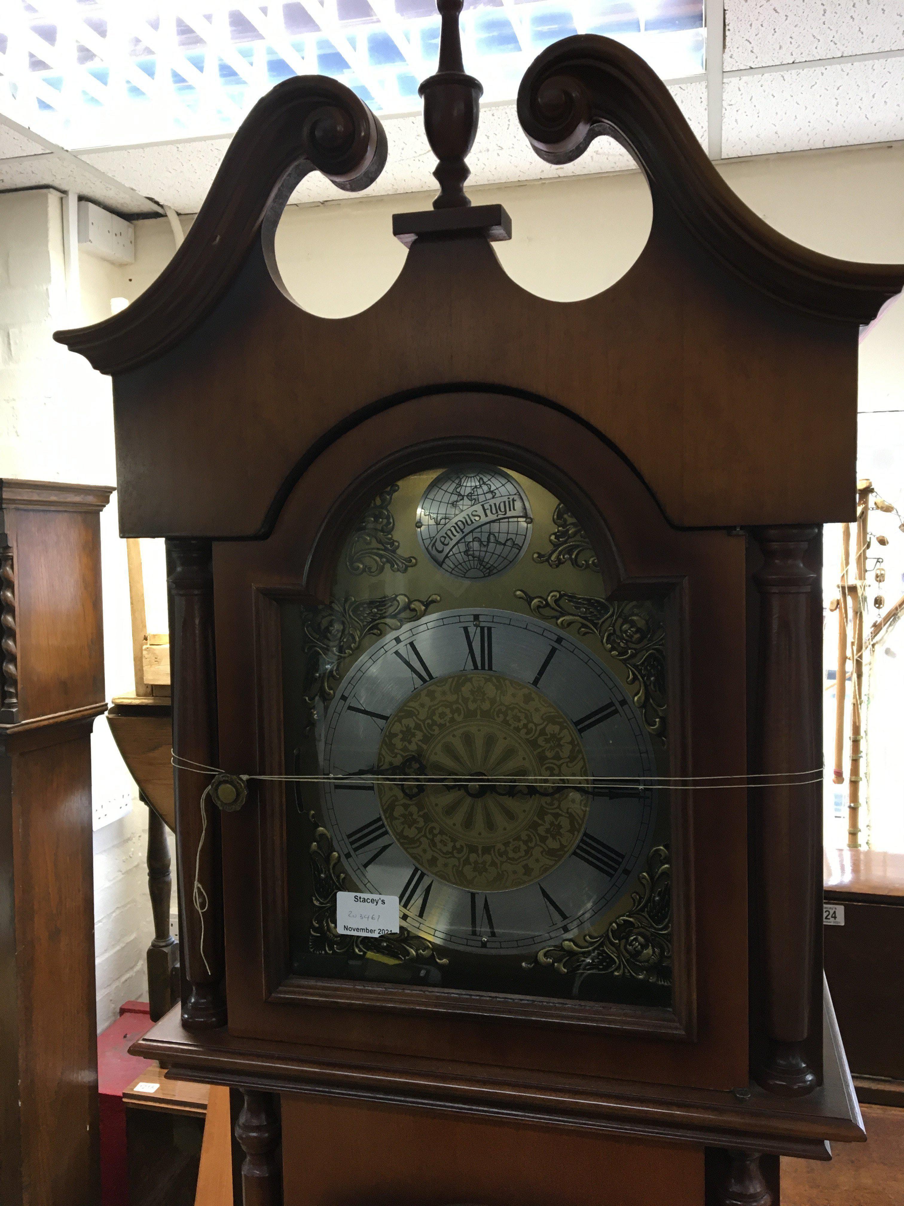 A modern longcase clock with a brass dial silvered