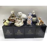 Seven boxed Royal Crown Derby paperweights compris