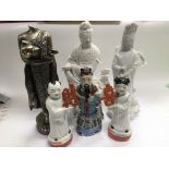 Six various Oriental style figures including a sch