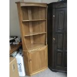 A blonde Ercol modern design corner display unit w