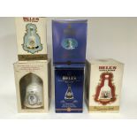 A collection of five bottles of commemorative Bell