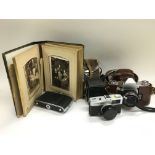 A collection of vintage cameras, a Victorian photo