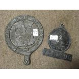 Two lead fire plaques. Size 25cm and 18cm