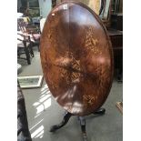 A Victorian inlaid walnut loo table the oval top o