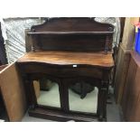 A Quality Rosewood Victorian chiffonier with a raised back above a serpentine shaped drawer with