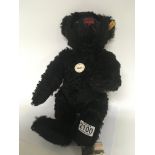 A Steiff Classic Black bear with attached tag and