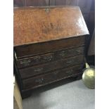 A George II style walnut bureau with a hinged fron