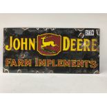 A reproduction Enamel sign for John Deere farm imp