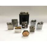 A collection of vintage petrol lighters.