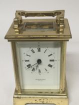 A brass carriage clock by Taylor & Bligh England.