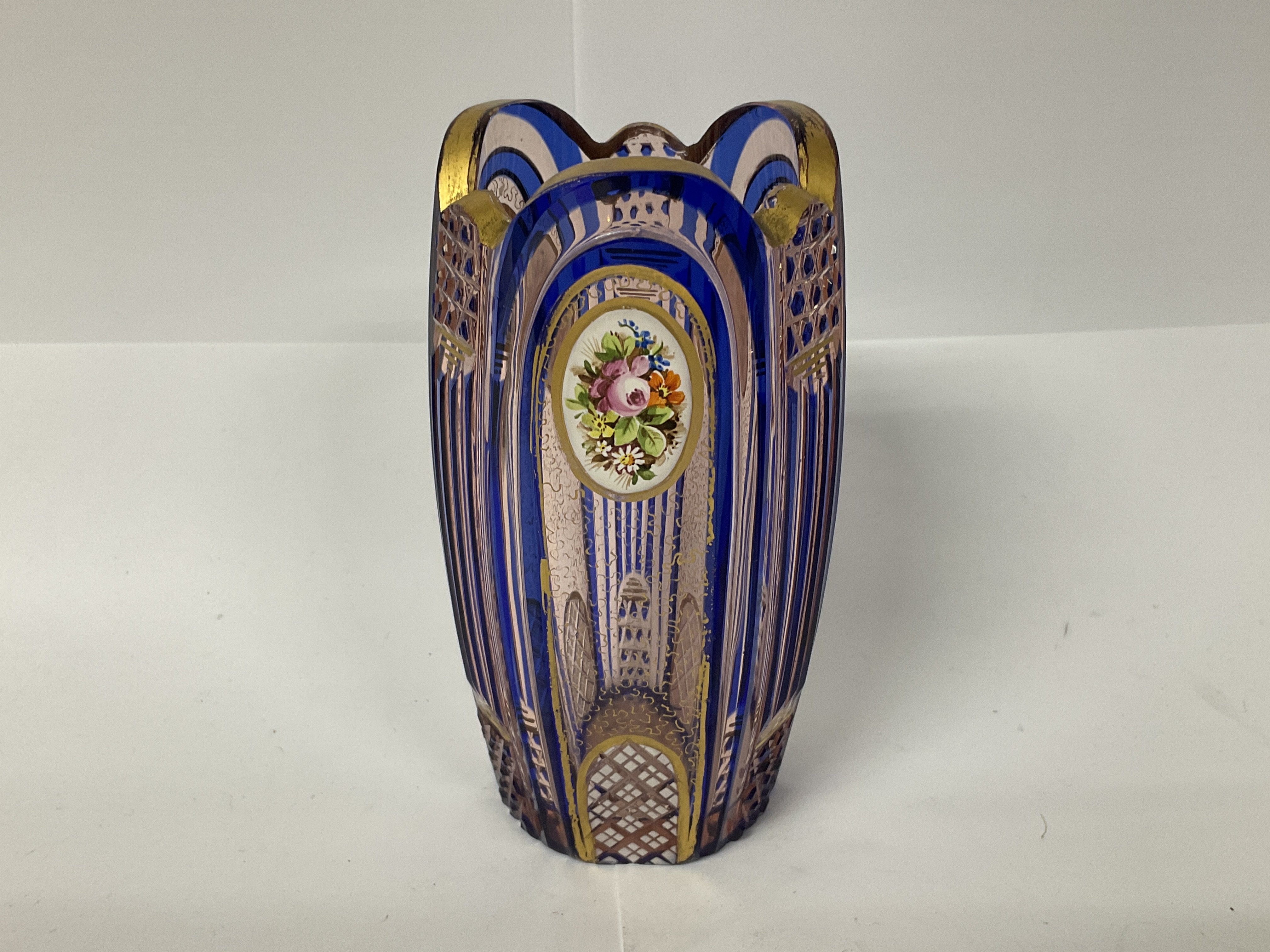 A small bohemian glass and gilt decorated vase wit